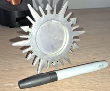 small silver sunburst mirror