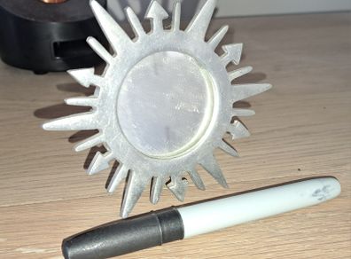 small silver sunburst mirror