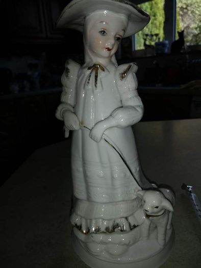 Lovely musical lady figurine with baby lamb.
