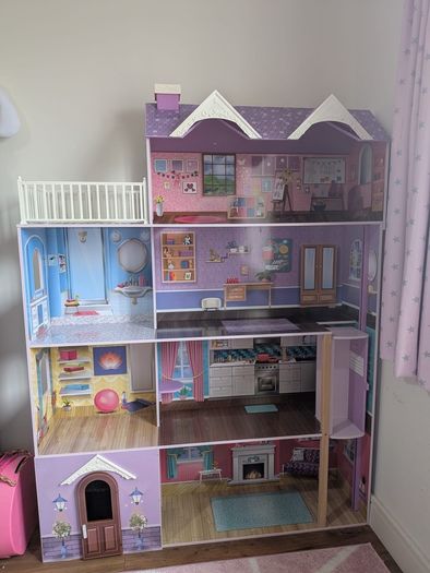 Large wooden dolls house with furniture