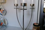 Beautiful silver toned triple flame candelabra, with 3 glass hurricane shades, and circular base