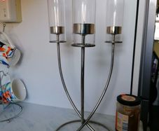 Beautiful silver toned triple flame candelabra, with 3 glass hurricane shades, and circular base