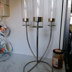 Beautiful silver toned triple flame candelabra, with 3 glass hurricane shades, and circular base