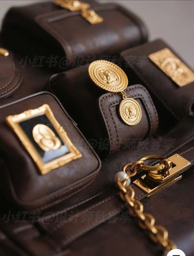 Vintage inspired dark brown backpack with antique gold details