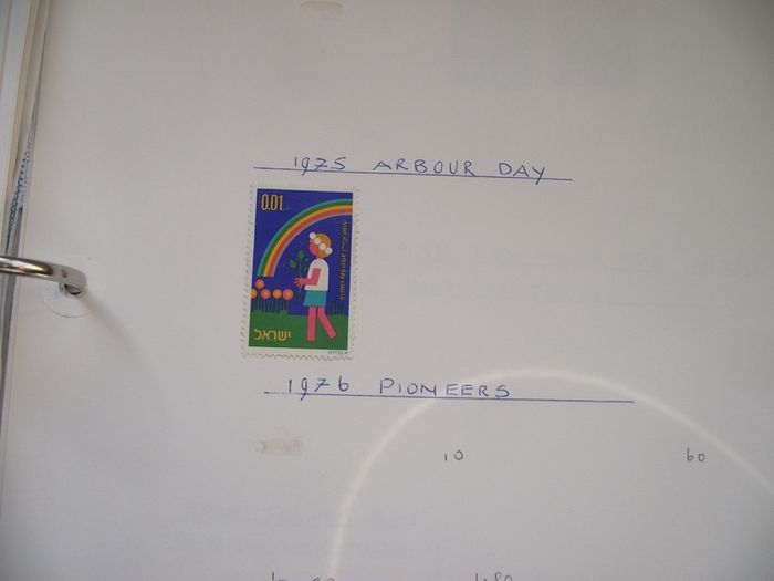 A collection of stamps from Isle of Man and Israel on albums pages (1950-1998) in the binder