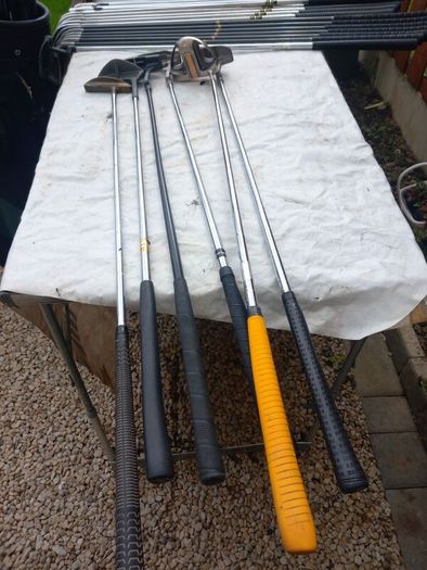 A selection of Golf clubs. Bags and golf balls.