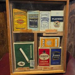 Old tabacco boxes and display case