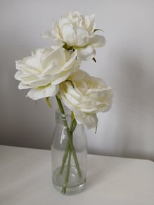 Faux flowers in small vase