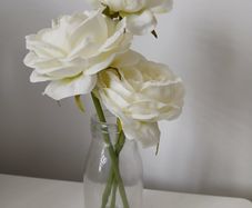 Faux flowers in small vase