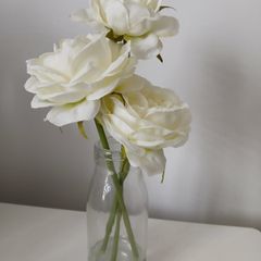 Faux flowers in small vase