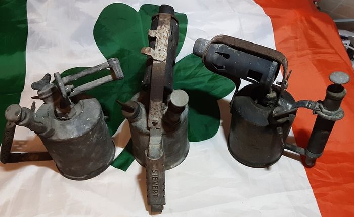 three vintage brass torches,