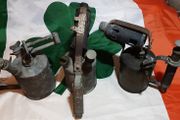 three vintage brass torches,