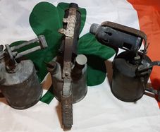 three vintage brass torches,