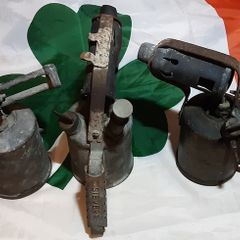 three vintage brass torches,