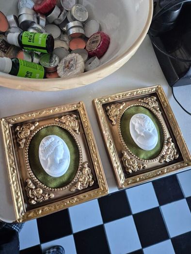 A pair of MidCentury Kelgin wall hanging Plaster  Vintage decorative pair of wall plaques featuring plaster cameos on green velvet background with ornate gold relief plaster frames
