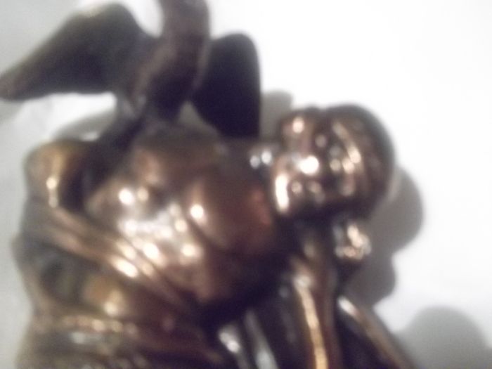 a bronze or metal the death of cuchulainn statue
