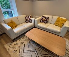 2 cream leather 2 seater sofas