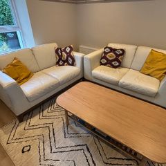 2 cream leather 2 seater sofas