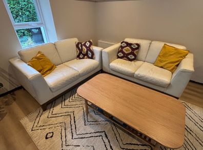 2 cream leather 2 seater sofas