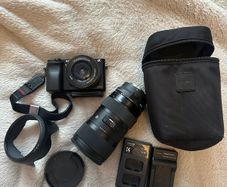 Sony A6000 + sigma 18-35mm F1.8 with Sony FE converter( original fitting on Nikon) small rig case included +batteries