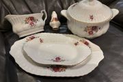 A vintage Chodziez rose pattern dinner service in the style of Old Country Rose