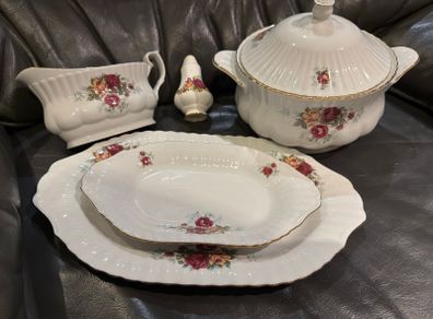 A vintage Chodziez rose pattern dinner service in the style of Old Country Rose