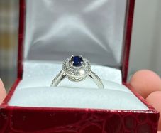 9ct White Gold Diamond Halo and Oval Sapphire Ring