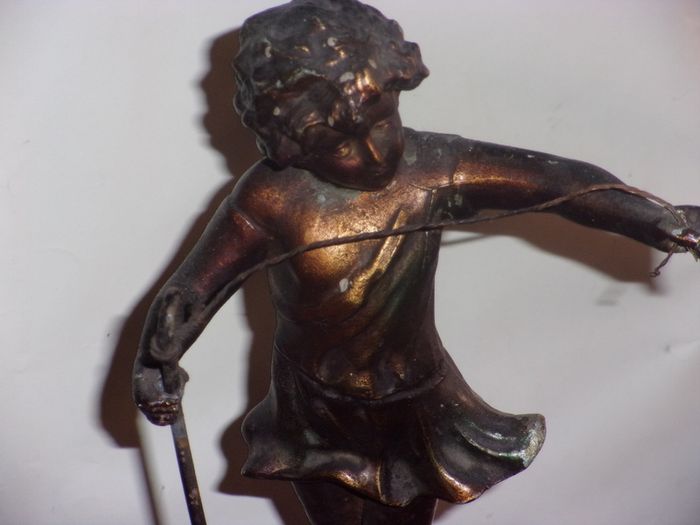 antique metal figure of a shepherd