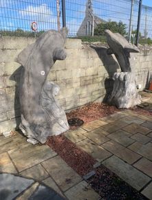 Pair Irish limestone dolphins 7 feet tall