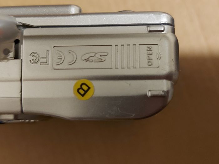 Z880 Digital Camera, Takes 2AA Batteries, working fine, has a modification that doesn't affect its performance