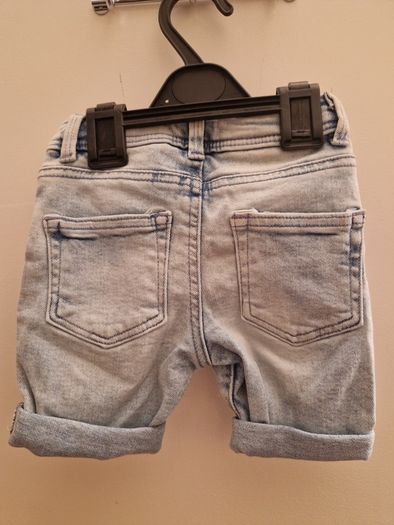 A selection of brand new baby clothes and items