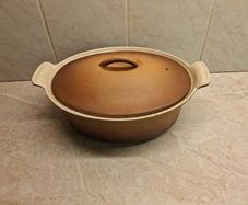 Le Creuset oval cast iron lidded casserole golden beige