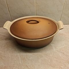 Le Creuset oval cast iron lidded casserole golden beige