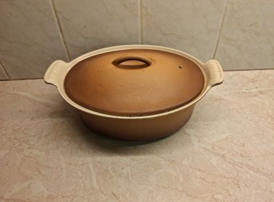 Le Creuset oval cast iron lidded casserole golden beige