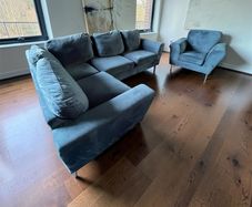 Blue velvet corner sofa with matching chair