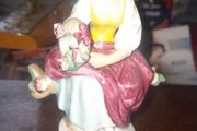 Seated Woman Holding a Reed of Flowers by German manufacturer Carl Scheidig Grafenthal, in good condition,