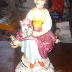 Seated Woman Holding a Reed of Flowers by German manufacturer Carl Scheidig Grafenthal, in good condition,