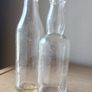 Lot of 2 small vintage Power whiskey bottles Image 3