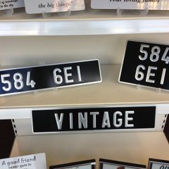 Pair Pressed Metal Vintage Plates