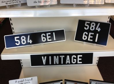Pair Pressed Metal Vintage Plates