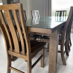 Dining table with glass top and 8 dining chairs