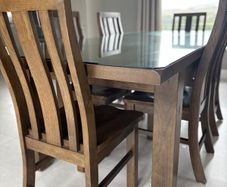Dining table with glass top and 8 dining chairs