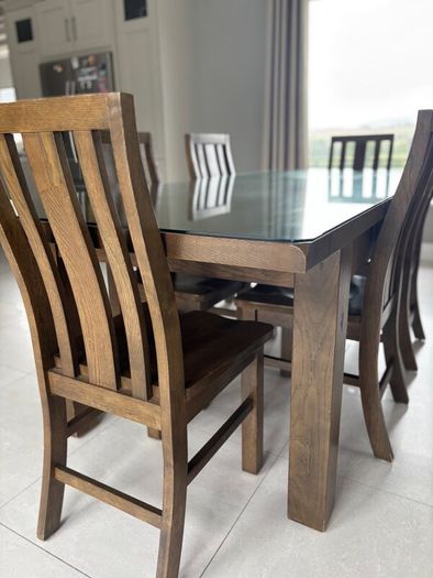 Dining table with glass top and 8 dining chairs