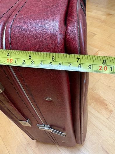 Vintage burgundy faux-leather suitcase