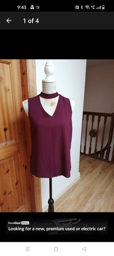 New look wine sleeveless top with choker neck. And zip opening at the back. size 8. Bust 18" length 24" New with tags