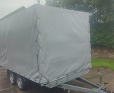 Twin axle tarp covered trailer