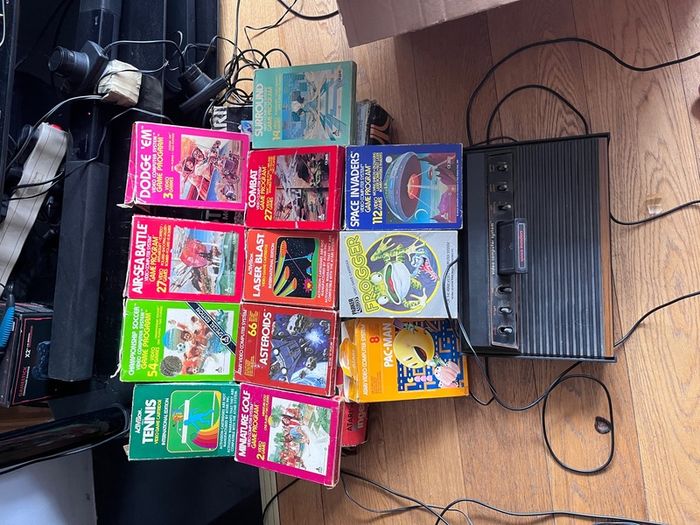 Atari 2600 Space Invaders Woody Atari 2600 with 15 individual games and 14 game Indy 500 driving