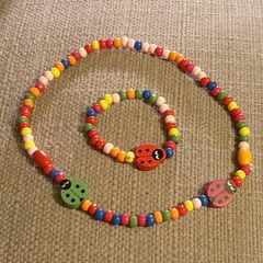 Necklace and bracelet made of wooden beads
