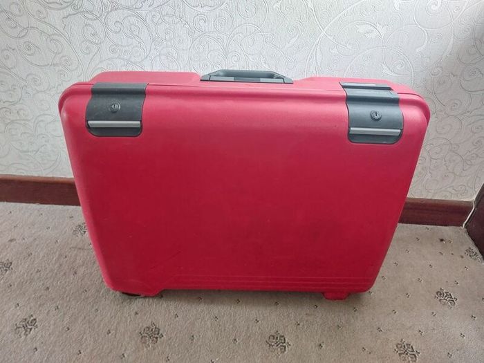 Red hard-shell suitcase