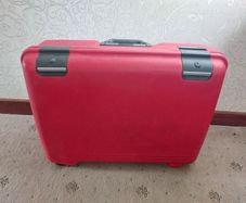 Red hard-shell suitcase